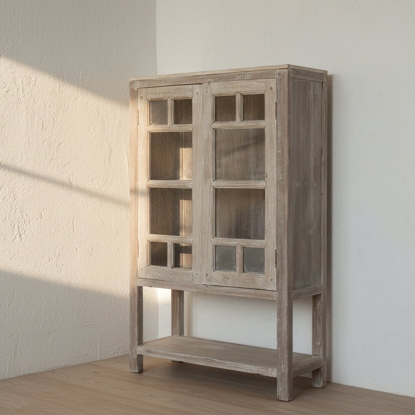 Wooden cabinet with glass doors in a minimalistic room