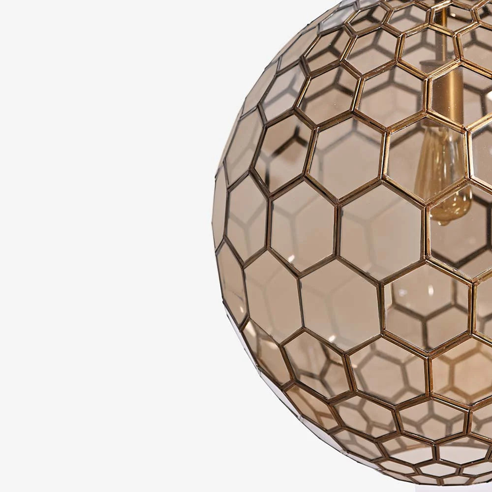 Decorative light fixture with hexagonal pattern on a white background