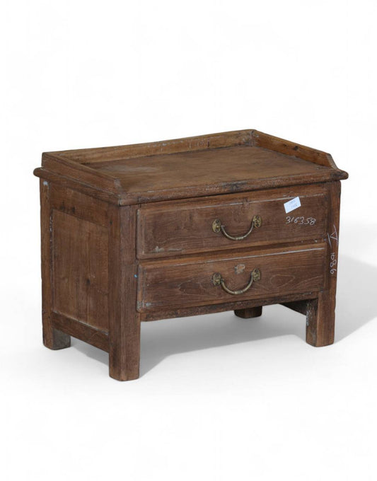 The Handcrafted Teak Keeper is a timeless blend of durability and rustic charm. Featuring two spacious drawers with antique-style brass handles