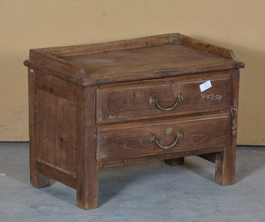 The Handcrafted Teak Keeper is a timeless blend of durability and rustic charm. Featuring two spacious drawers with antique-style brass handles.