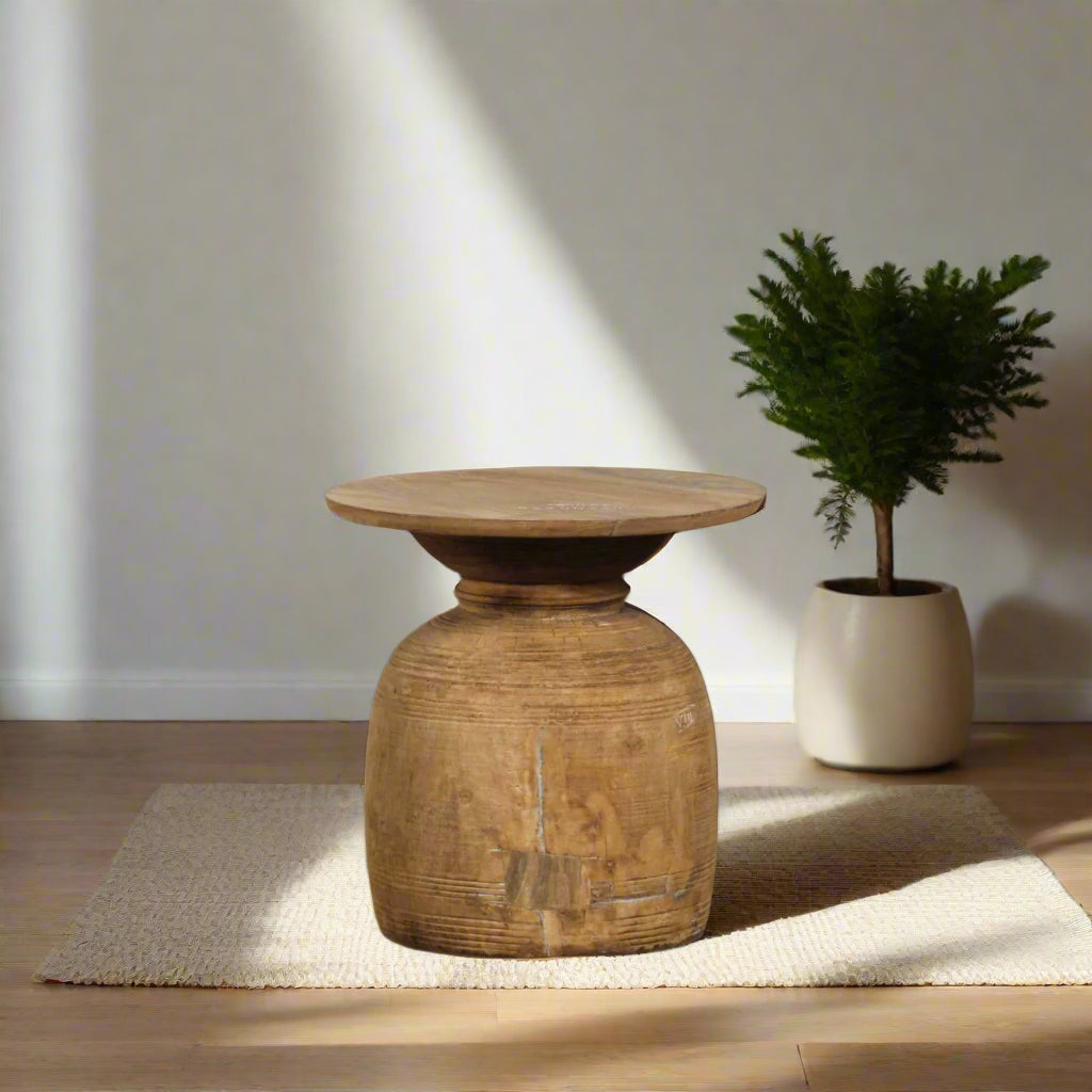 The Handcrafted Wooden Side Table, made from eco-friendly recycled wood, combines sustainability with unique craftsmanship.