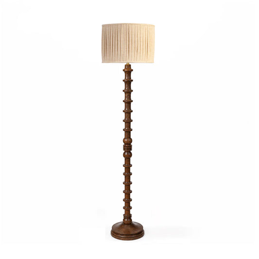 Wooden floor lamp with a beige lampshade on a white background