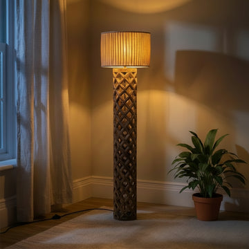 Decorative floor lamp in a room with a chair and curtain