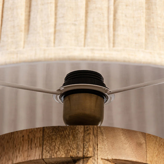 Close-up of a ceiling fan with light fixture and lampshade.