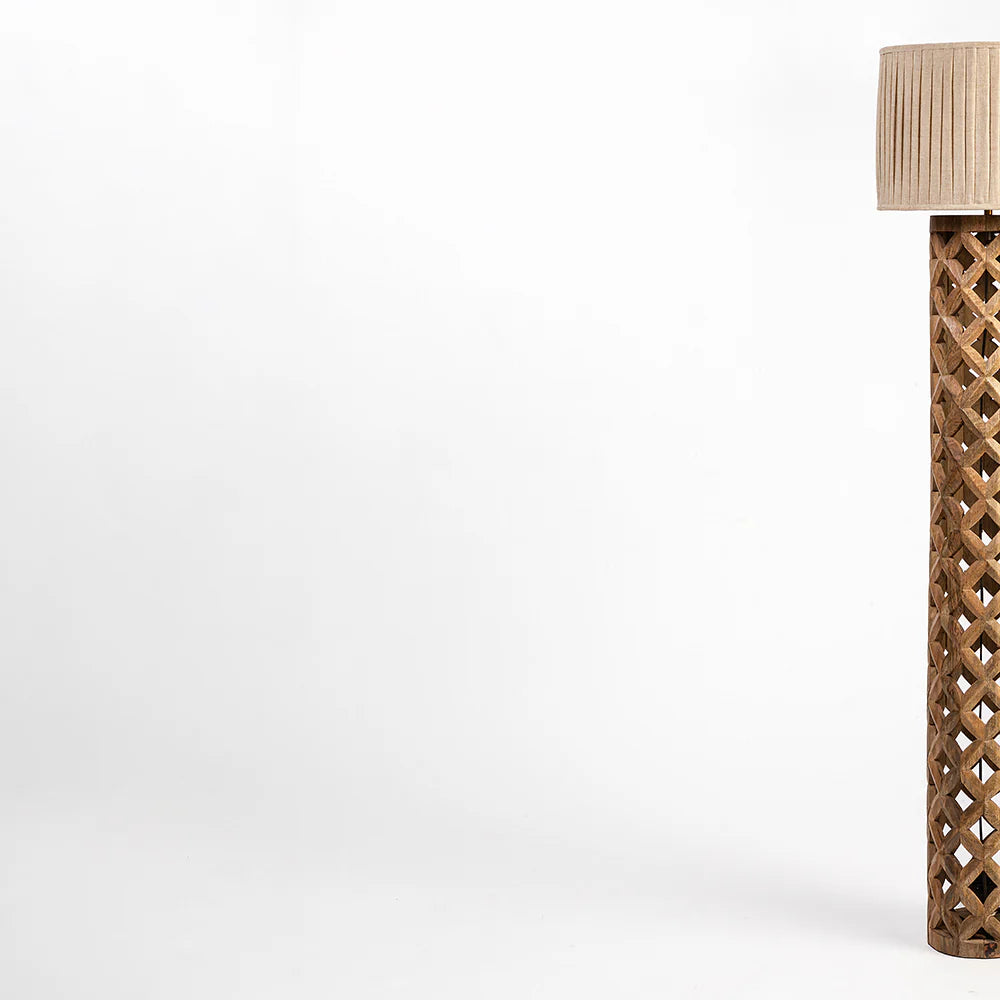 Tall decorative column with lattice design on a white background