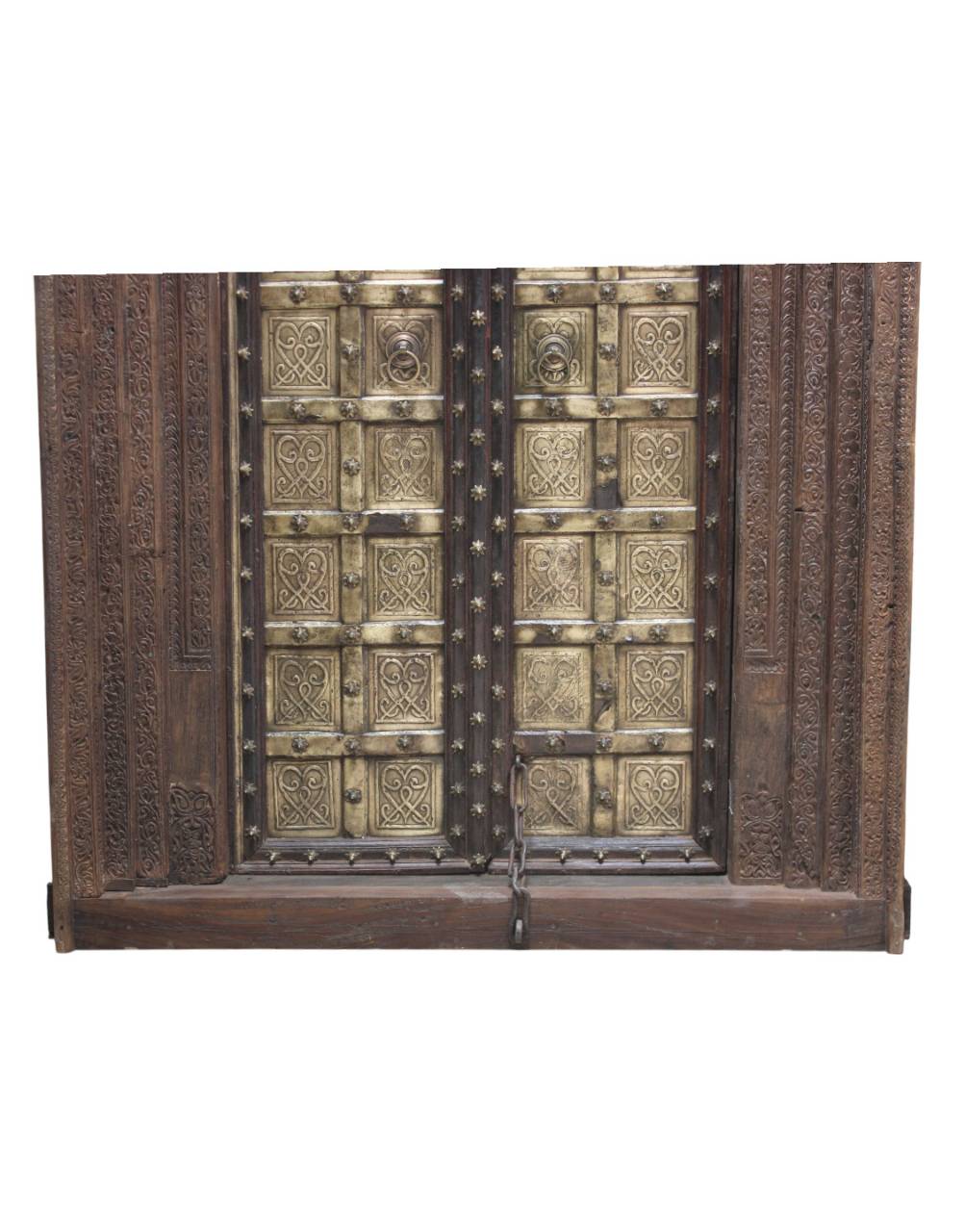 Decorative wooden and metal door with intricate carvings on a white background