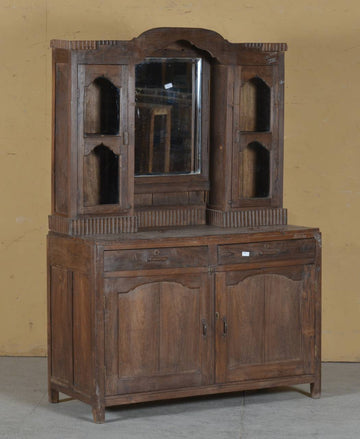 Vintage wooden cabinet with glass doors against a plain background