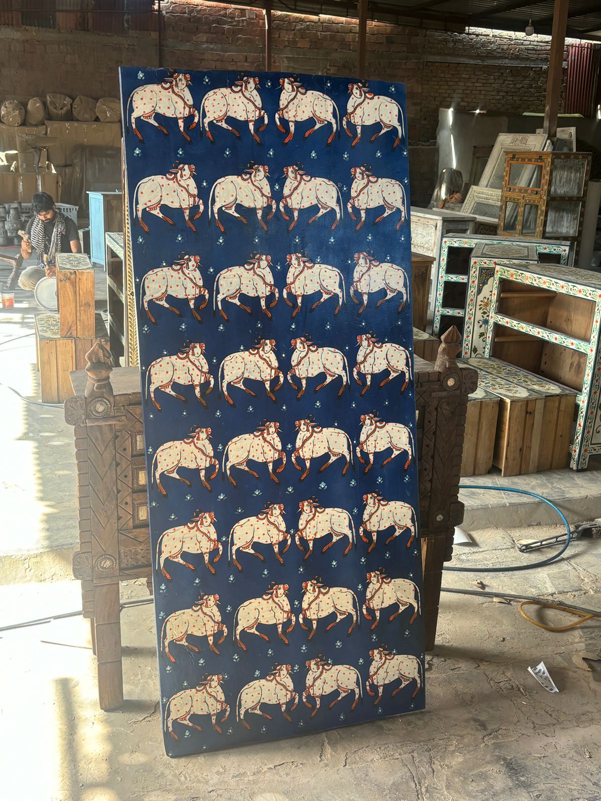 Celebrate Indian folk heritage with the Kamdhenu Folk Panel, a striking wall artwork handcrafted on recycled wood and adorned with traditional hand-painted cow motifs. 