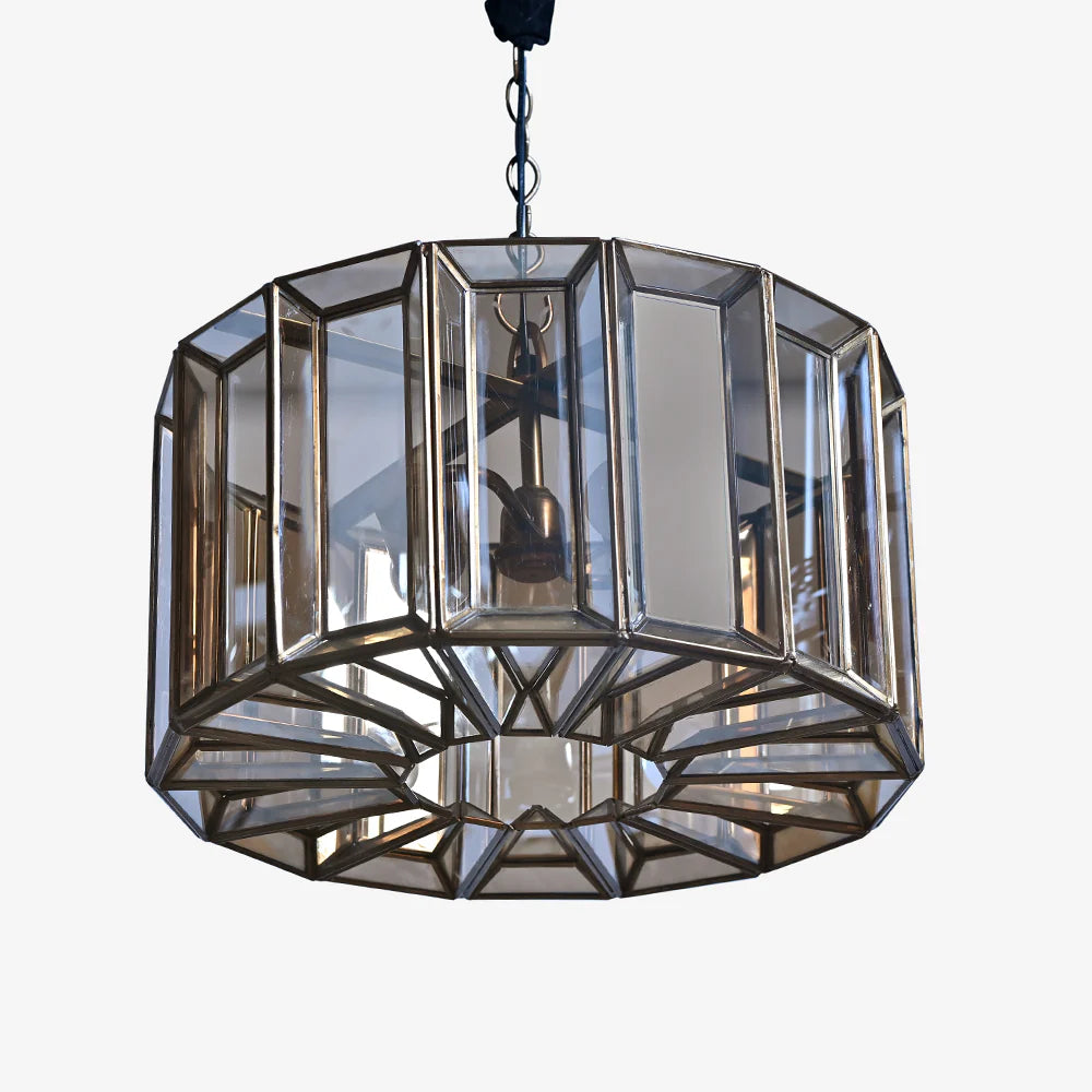 The antique brass finish and soft golden tint add a touch of vintage luxury,