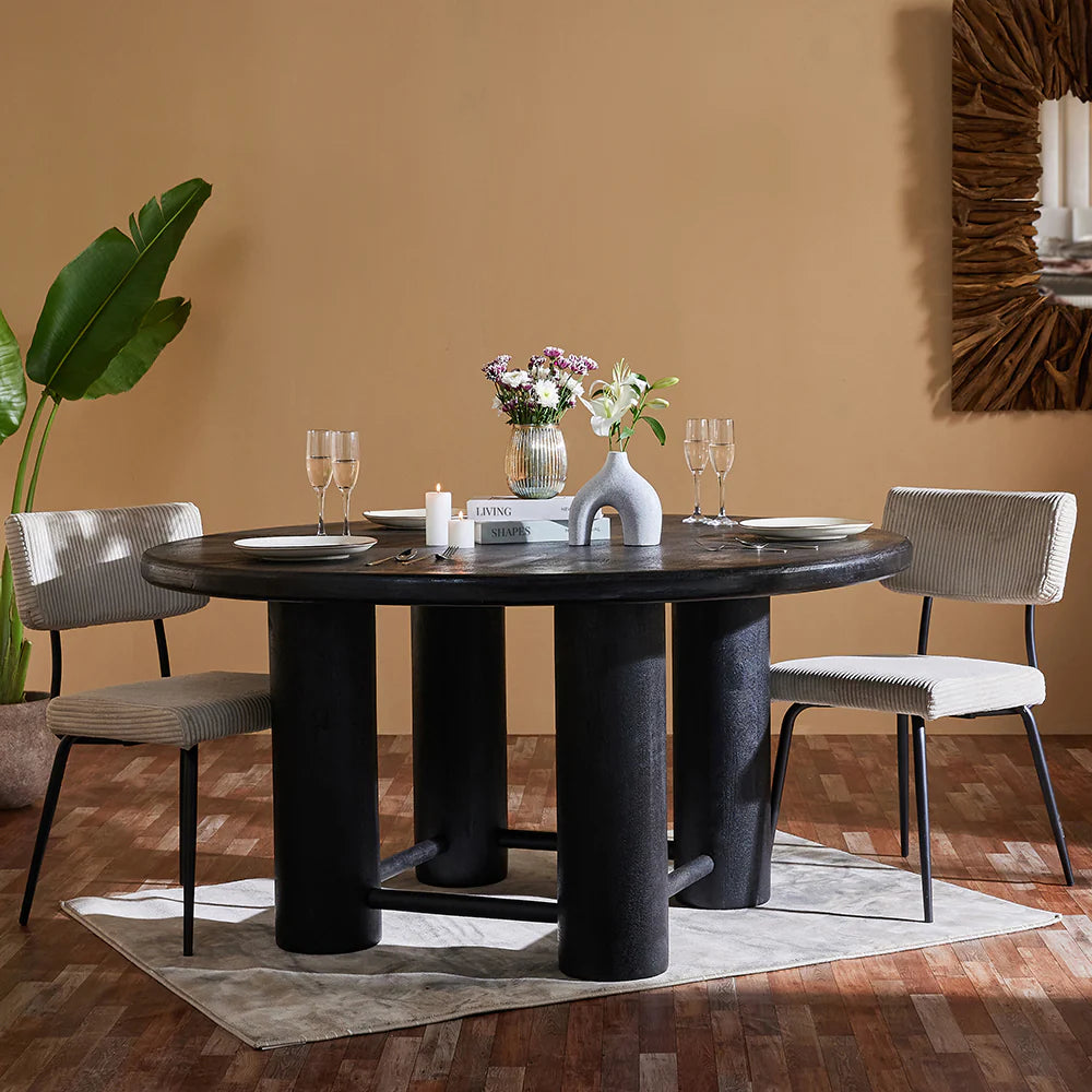 Introduce warmth and character into your dining space with our Mango Wood Round Dining Table. Crafted from high-quality, sustainable mango wood, this table offers a blend of natural beauty and sturdy craftsmanship. 