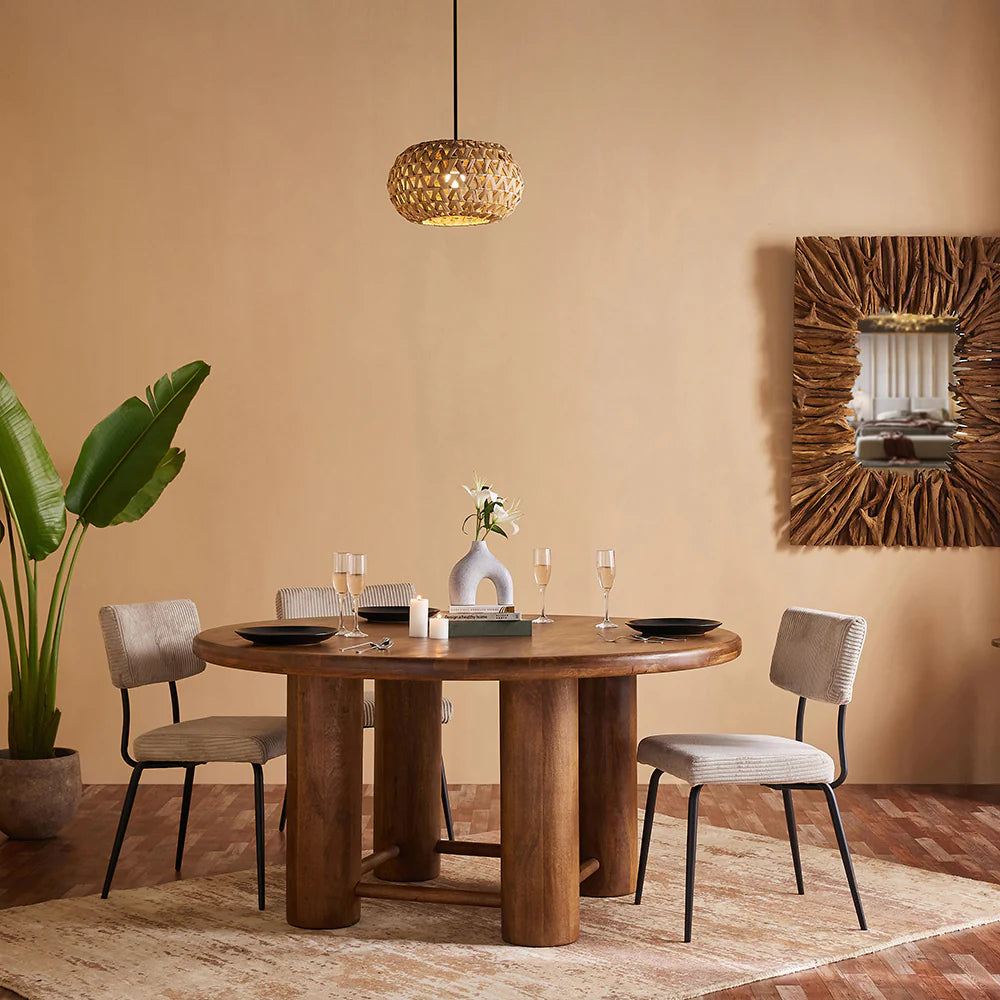 Introduce warmth and character into your dining space with our Mango Wood Round Dining Table. Crafted from high-quality, sustainable mango wood, this table offers a blend of natural beauty and sturdy craftsmanship. 