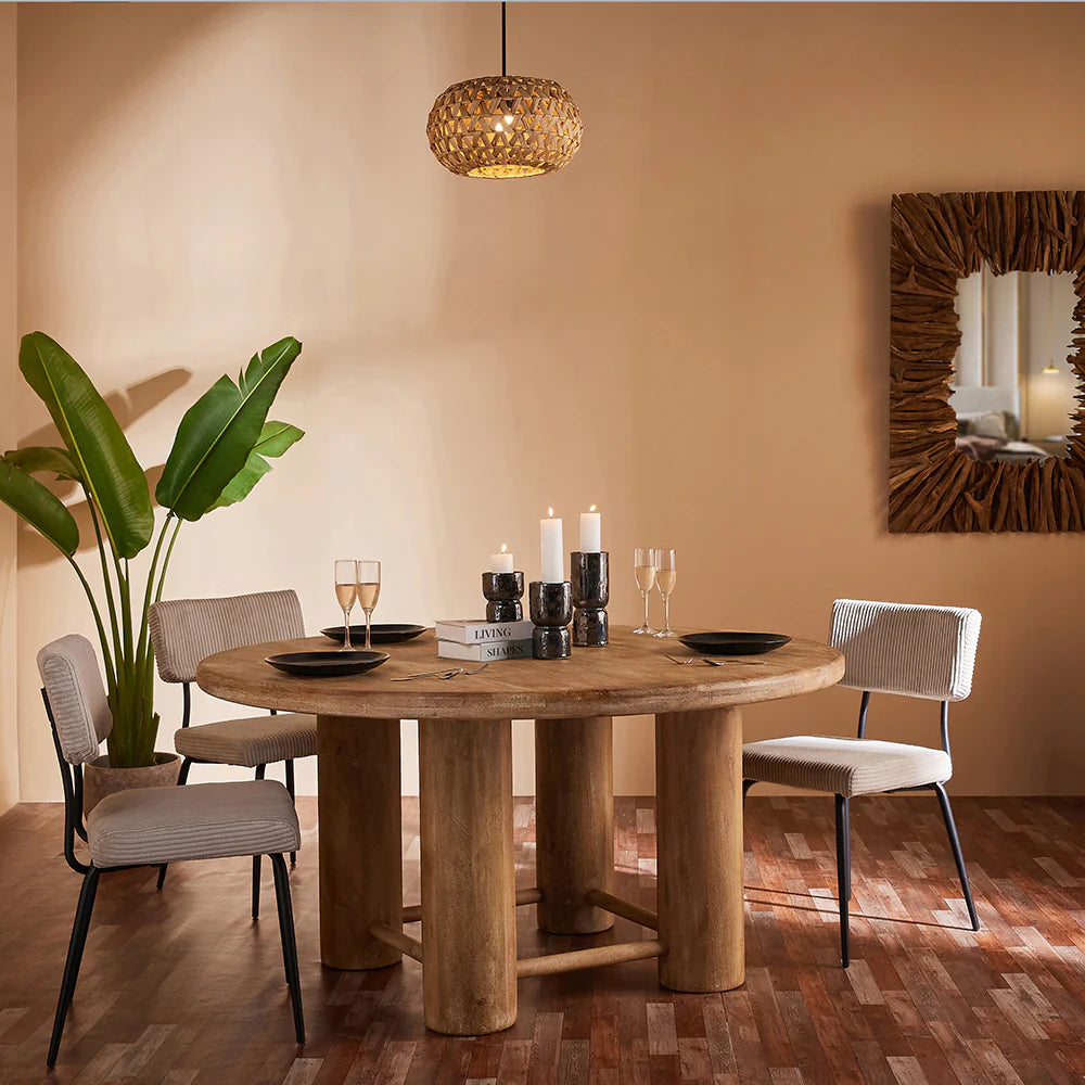 Introduce warmth and character into your dining space with our Mango Wood Round Dining Table. Crafted from high-quality, sustainable mango wood, this table offers a blend of natural beauty and sturdy craftsmanship. 