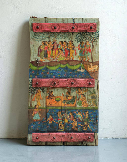 Inspired by the timeless beauty of Madhuban, this painted teak panel captures a serene narrative through intricate folk-inspired artwork and naturally aged wood. 
