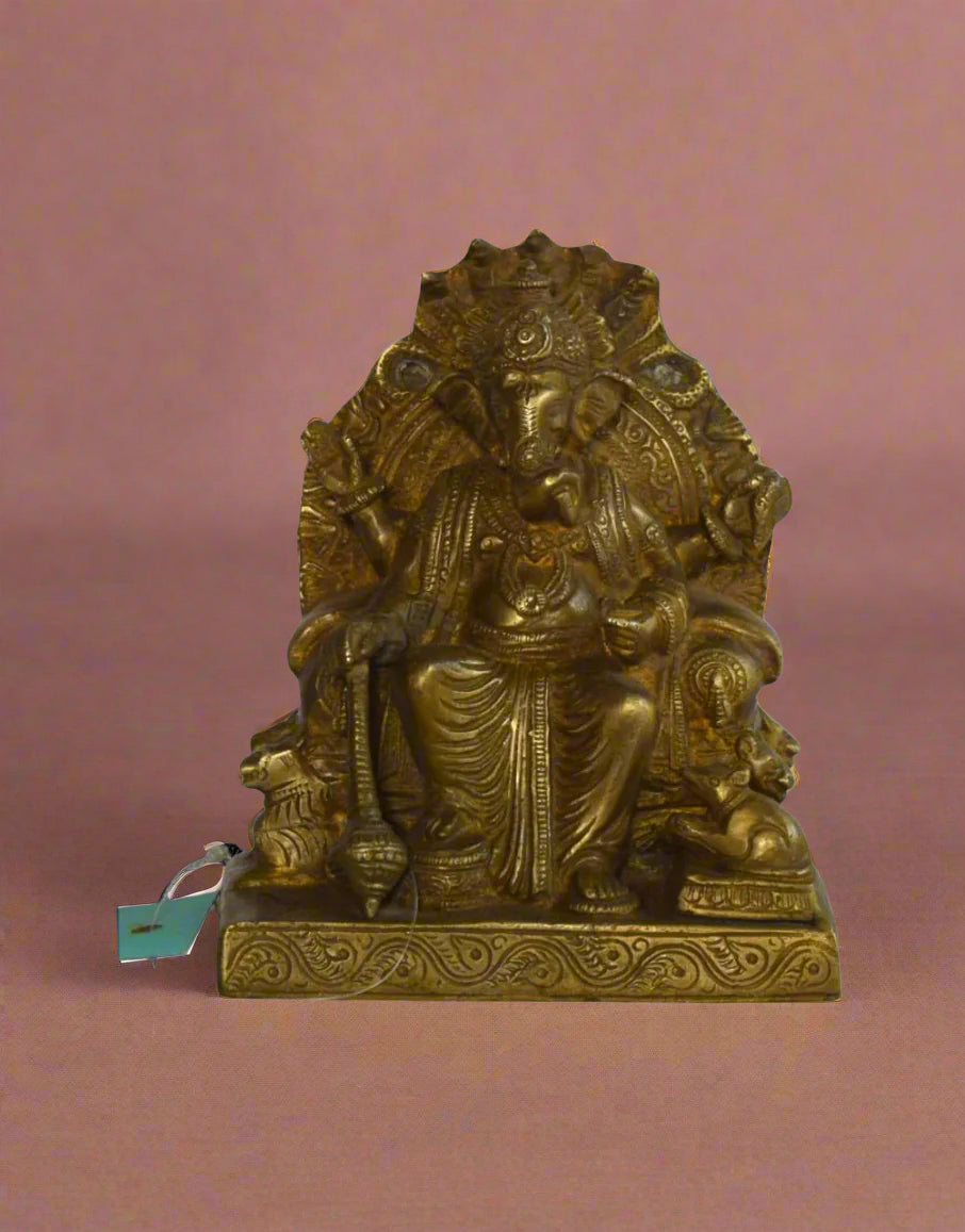 Add a touch of royalty and divine grace to your home with the Maharaja Ganesha – a beautifully handcrafted brass idol of Lord Ganesha seated on an ornate throne. 