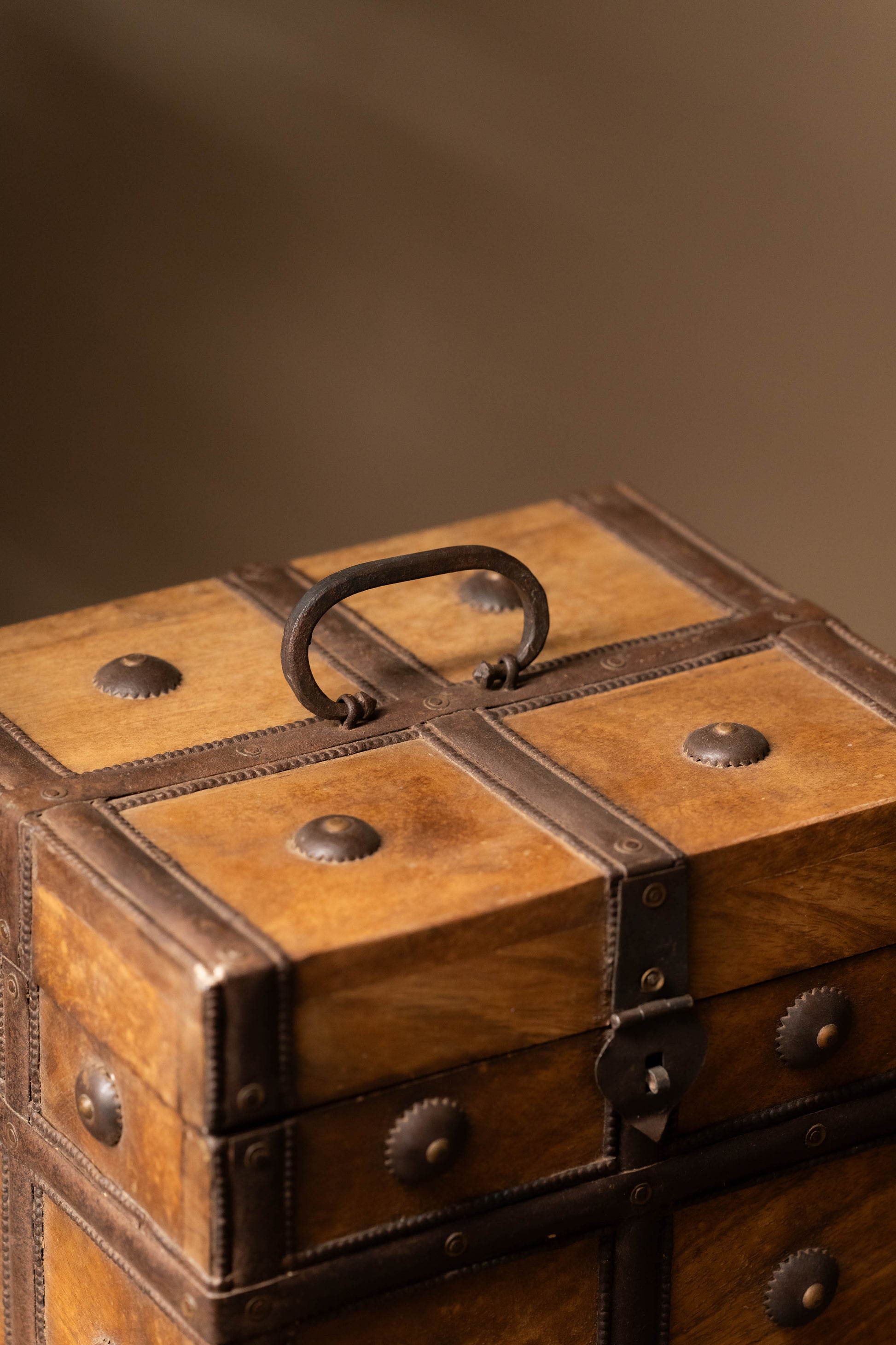 Reinforced with rustic metal accents, this chest blends vintage charm with durability, making it a perfect storage solution for treasured keepsakes, jewelry, or heirloom items.