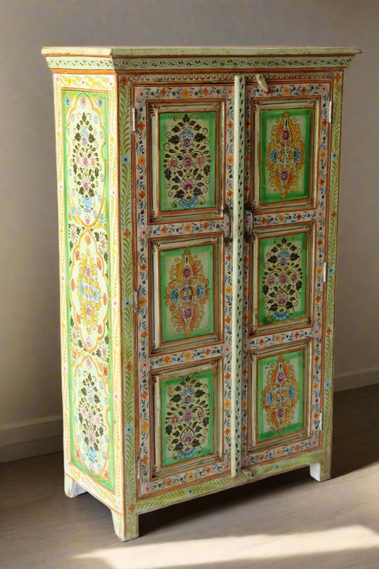 beautifully hand-painted cabinet crafted from solid mango wood. Featuring intricate floral artwork in vibrant green, yellow, and multicolor tones, this console is a true testament to traditional Indian craftsmanship.