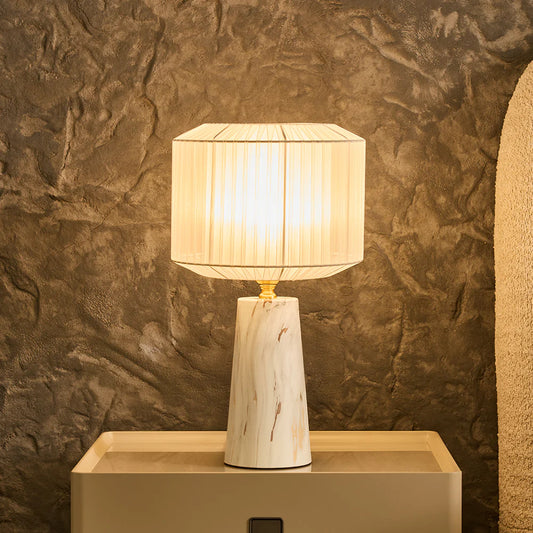 The Marbella Table Lamp brings a refined glow to your space with its graceful design and ambient light. 