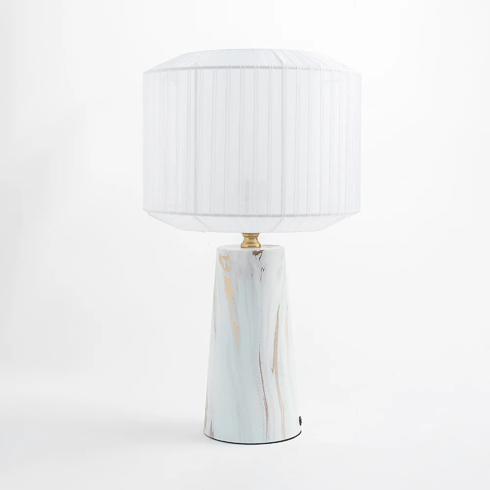 Featuring a marble-finish metal base paired with a pleated ribbon shade,