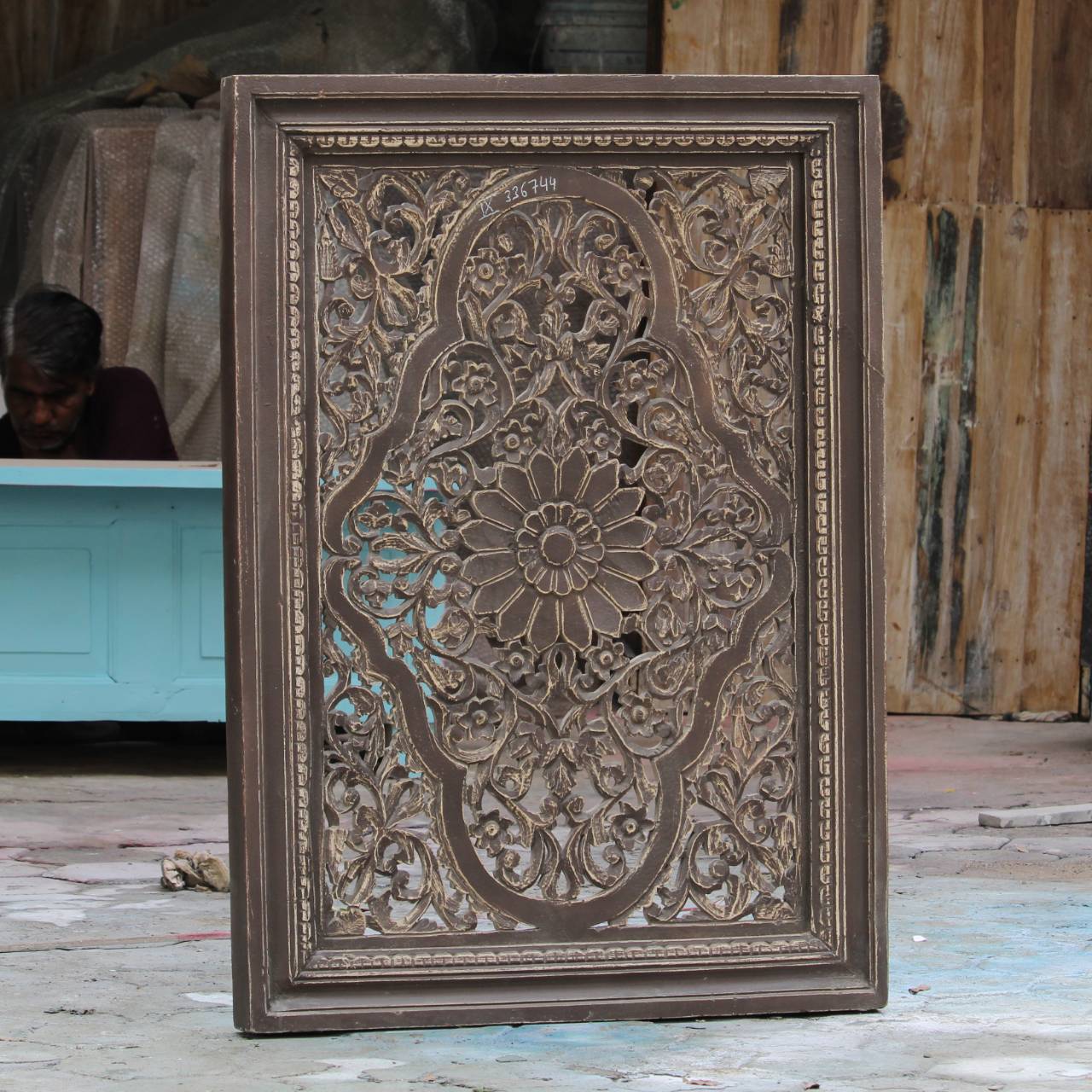 The symmetrical design and weathered finish make it a perfect centerpiece for living rooms, hallways, or meditation corners.