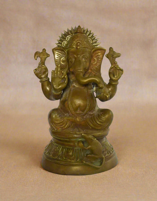 Honor the deep spiritual bond between wisdom and humility with Mushakvahan Moorti, a finely detailed brass idol of Lord Ganesha seated gracefully upon a lotus pedestal, accompanied by his sacred vehicle — the Mushak (mouse). 