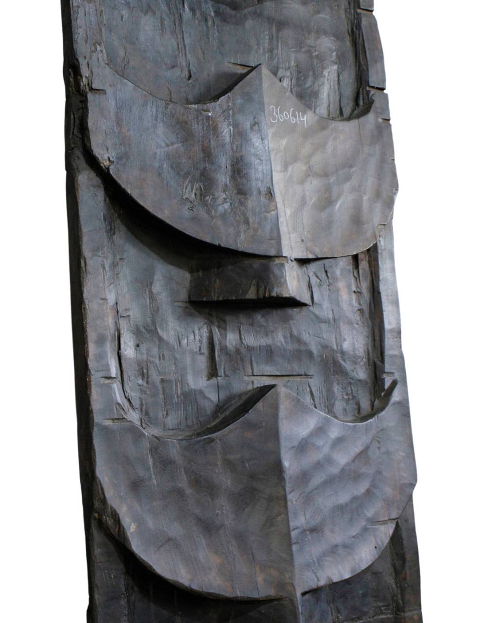 An abstract dark metal wall sculpture with layered, curved geometric shapes and a textured hammered finish, shown against a plain white background.