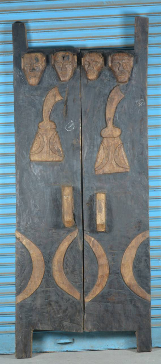 Decorative wooden panel with carvings on a blue background