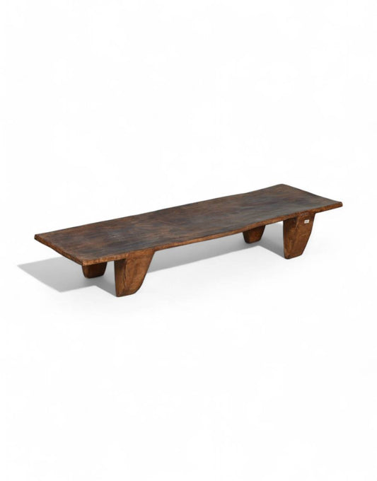 Hewn from a single wide plank and set on four&nbsp;sculpted block legs, this Naga Solid Wood Low Table carries the quiet authority of tribal craftsmanship. 