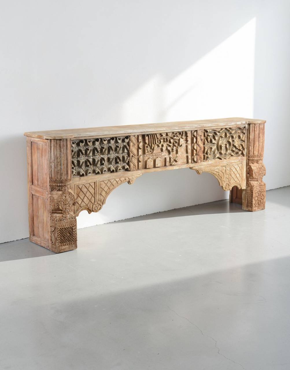 The Nakashi Teak Console is a celebration of India's rich carving traditions, where every intricate detail reflects the artistry of skilled craftsmen. 
