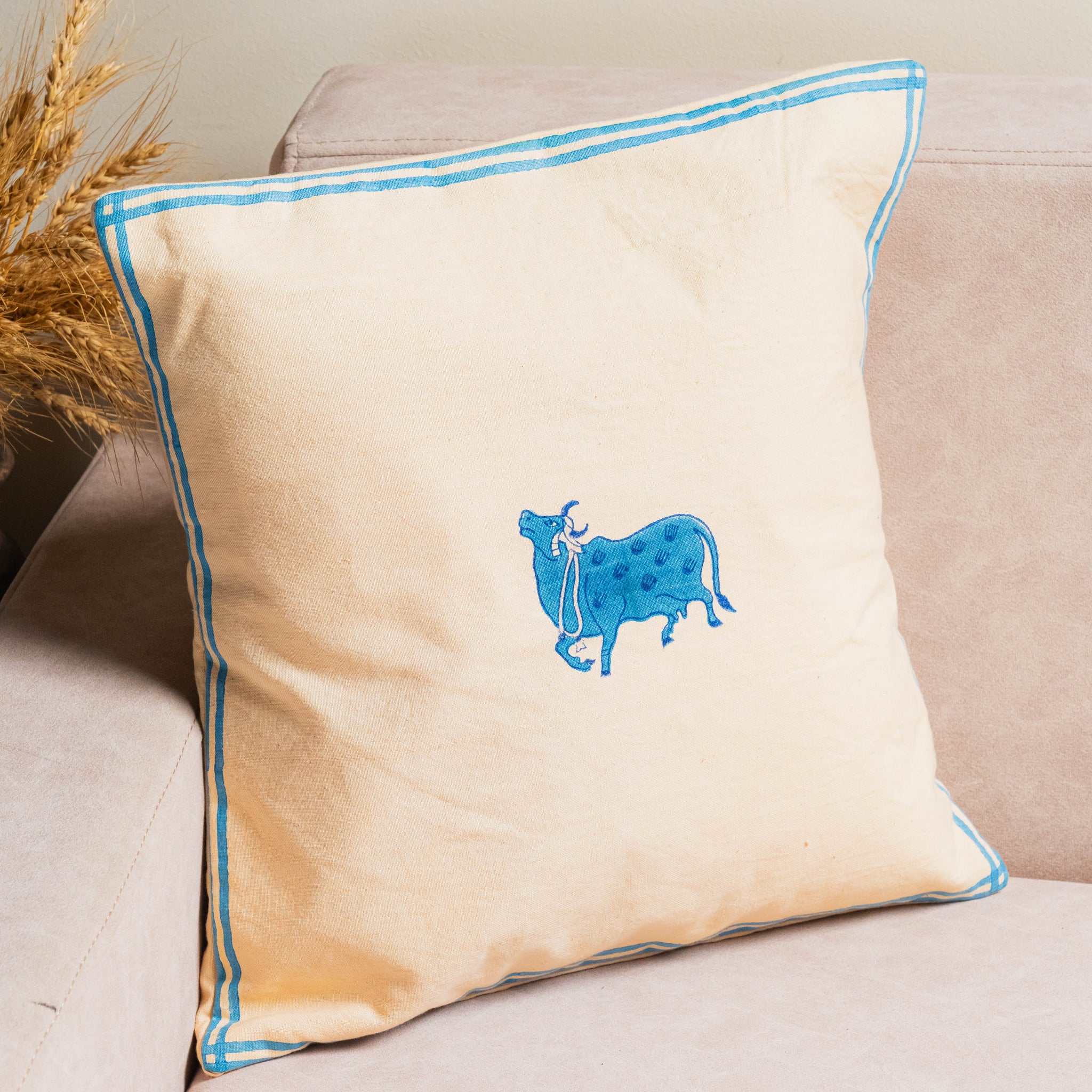 Handcrafted cotton cushion covers – floral, striped, geometric, and cow motif designs – perfect for modern and ethnic home decor.