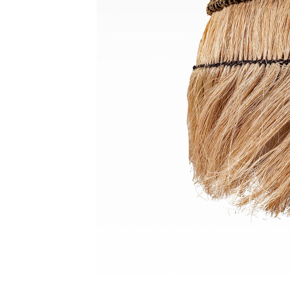 Close-up of a broom with bristles on a white background