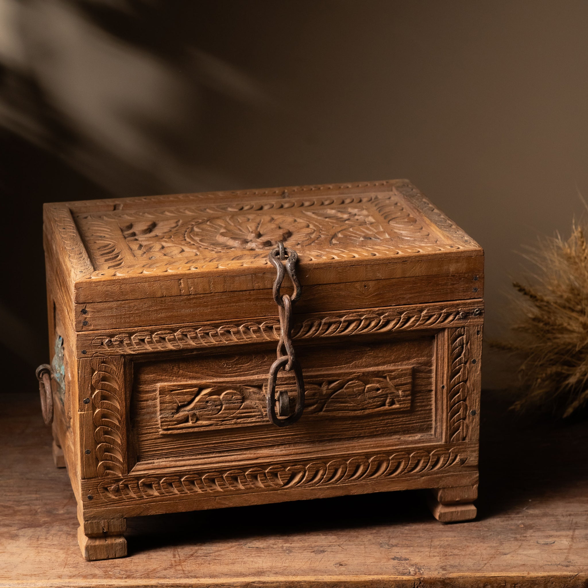 Made from reclaimed wood, this chest embodies the timeless beauty of aged timber, each grain and carving telling a story of its past.