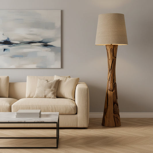 Wooden floor lamp with a beige lampshade in a room with wooden furniture and a plant.