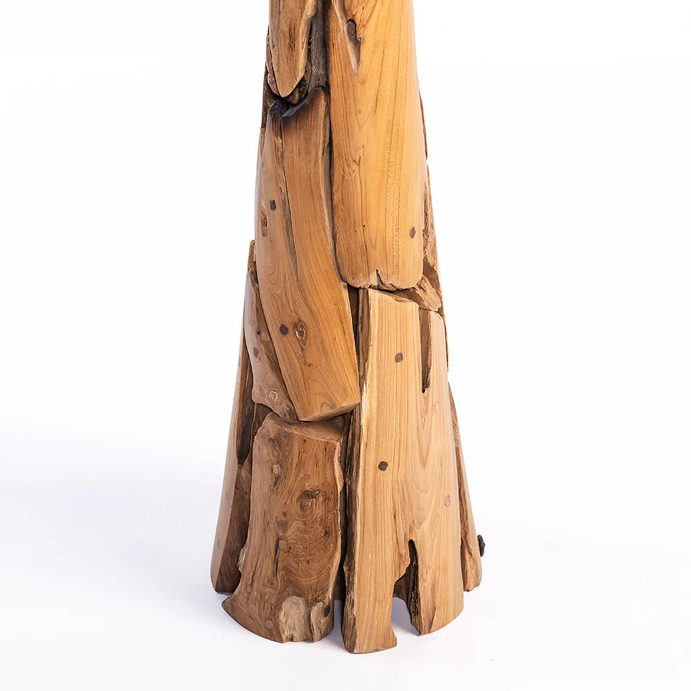 Wooden sculpture with layered planks on a white background