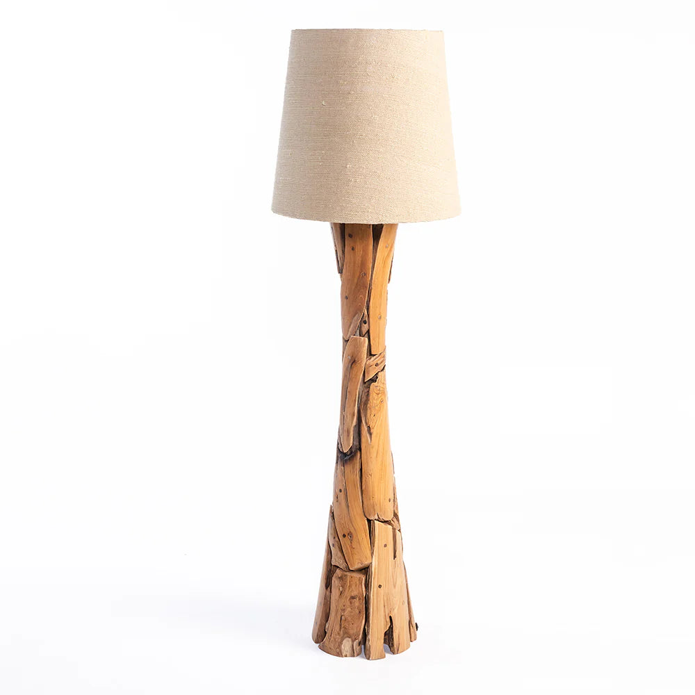 Floor lamp with wooden base and beige lampshade on a white background