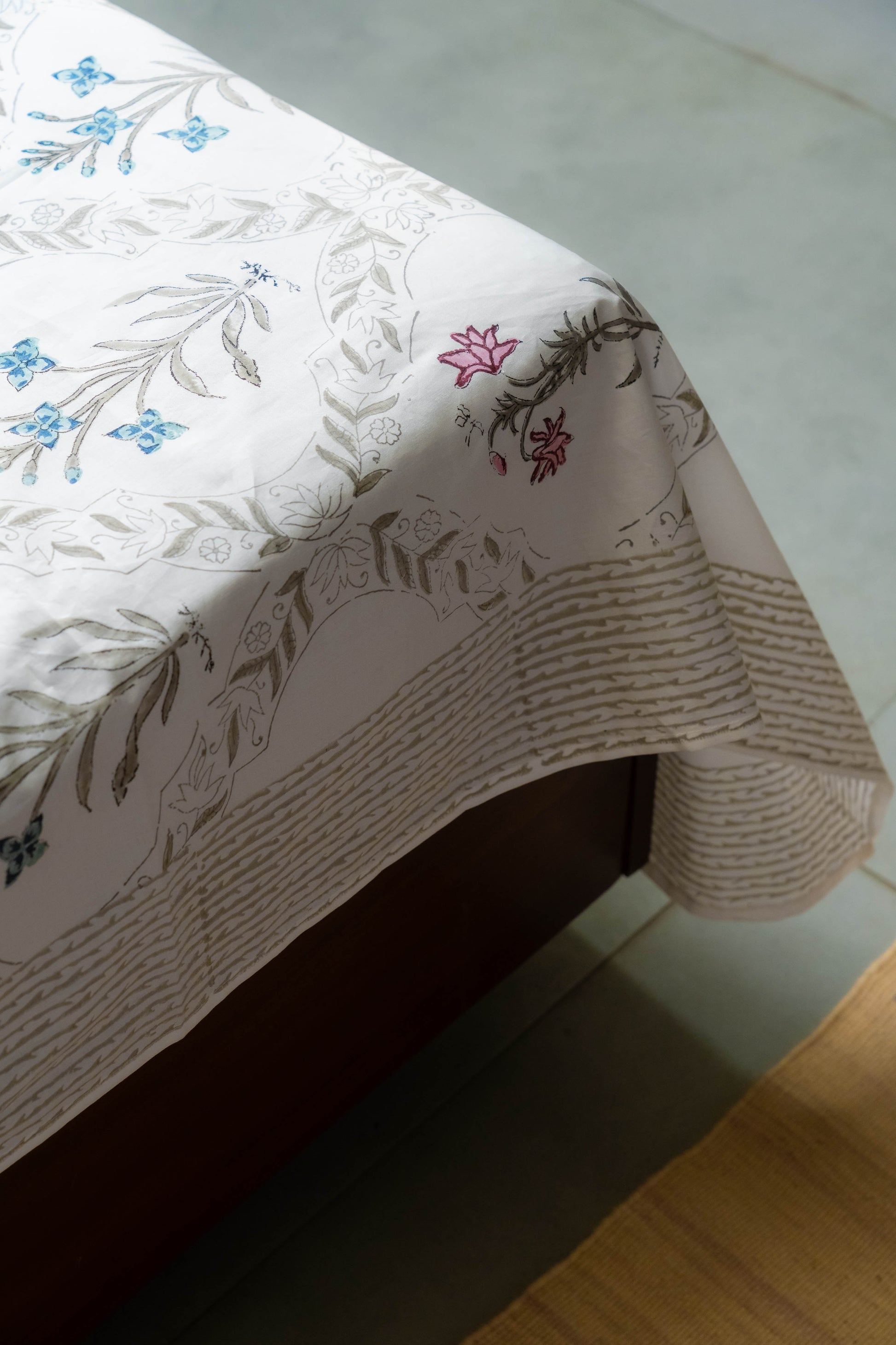 Floral-patterned tablecloth on a table with a white surface