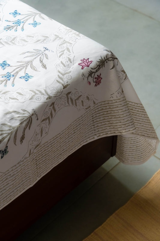 Floral-patterned tablecloth on a table with a white surface