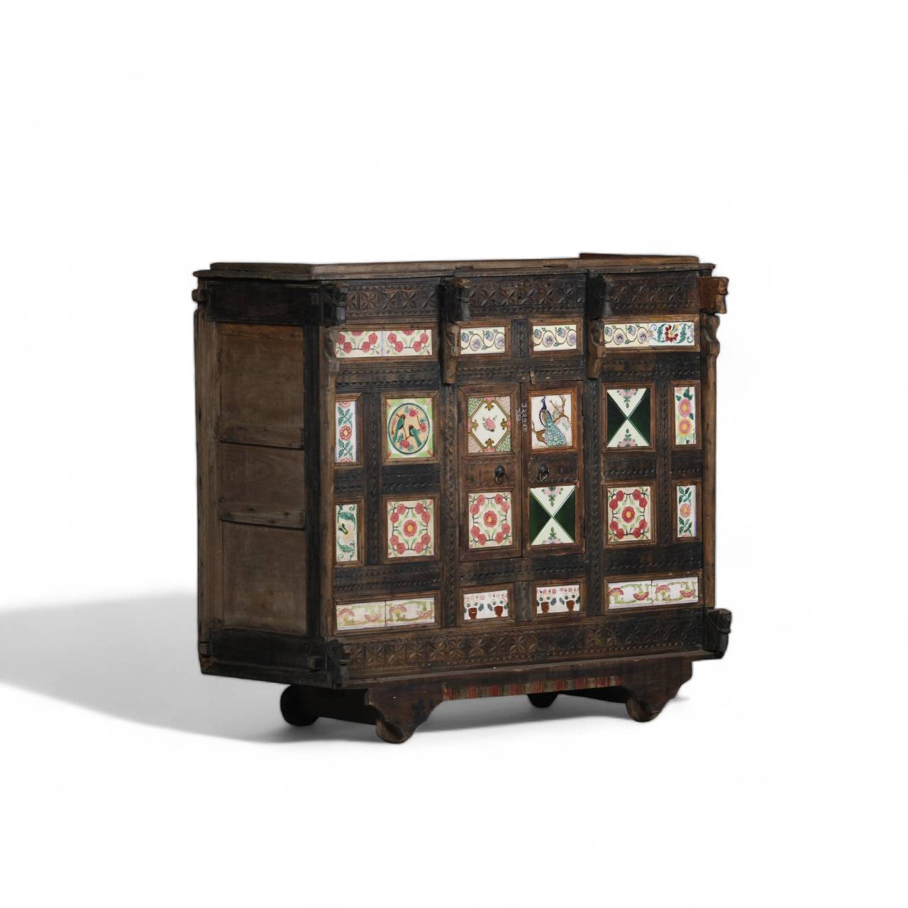 Handcrafted from premium teak wood, this heritage chest is adorned with hand-painted panels featuring regal peacocks, blooming flowers, and symbolic cultural motifs.