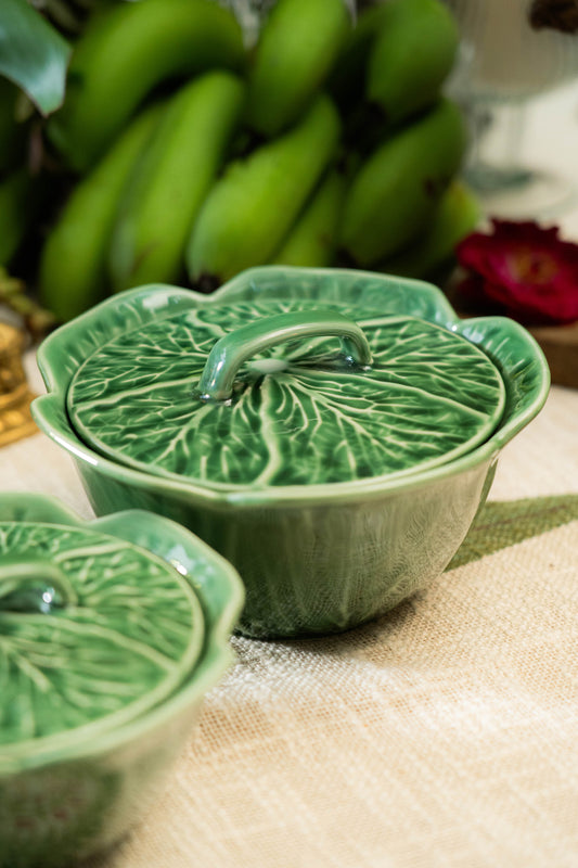 Green ceramic dish with leaf design on a table