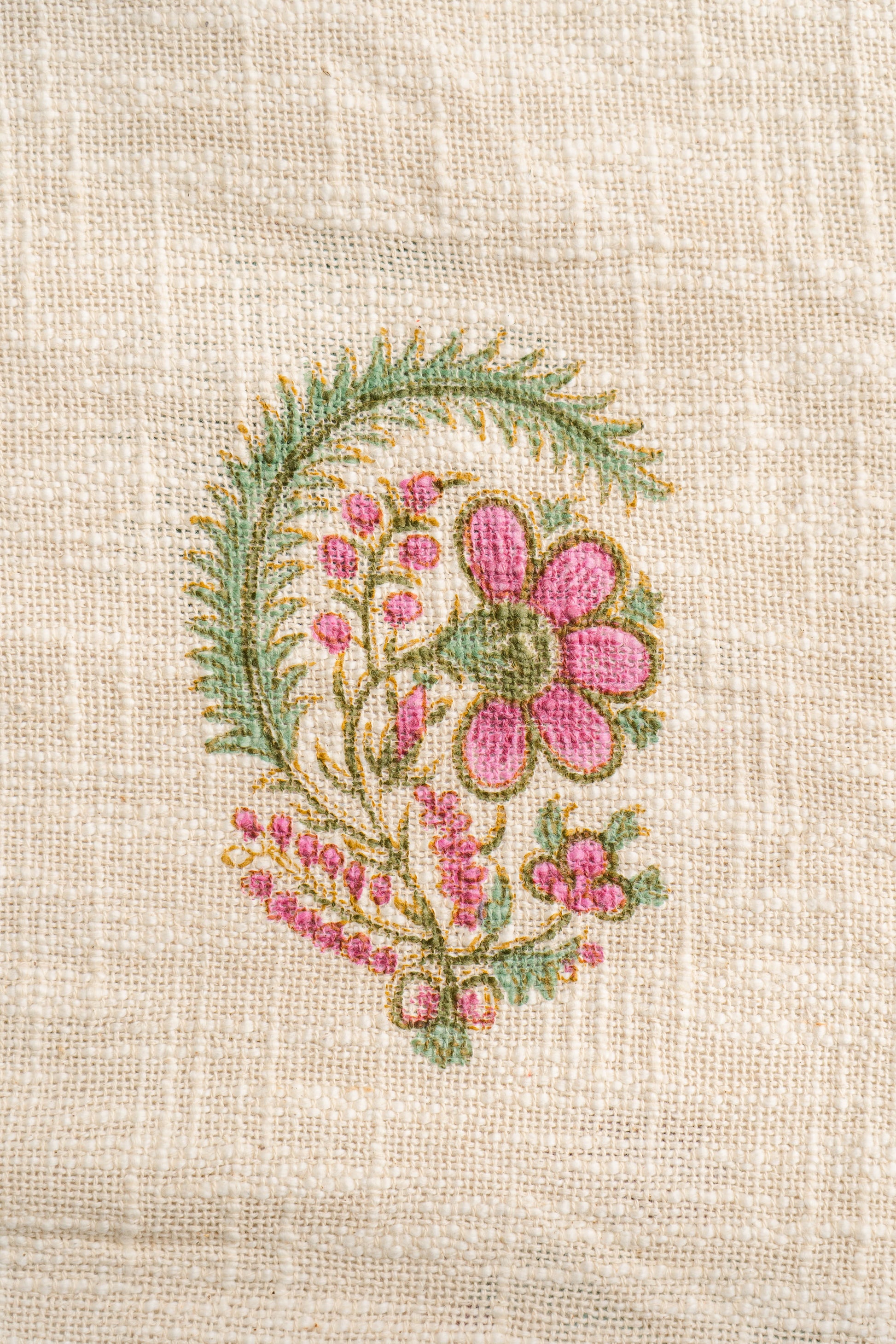 Floral embroidery design on beige fabric