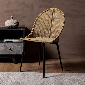 Embrace the perfect blend of natural elegance and industrial strength with our Rattan Arc Chair, expertly crafted with a sturdy iron frame.