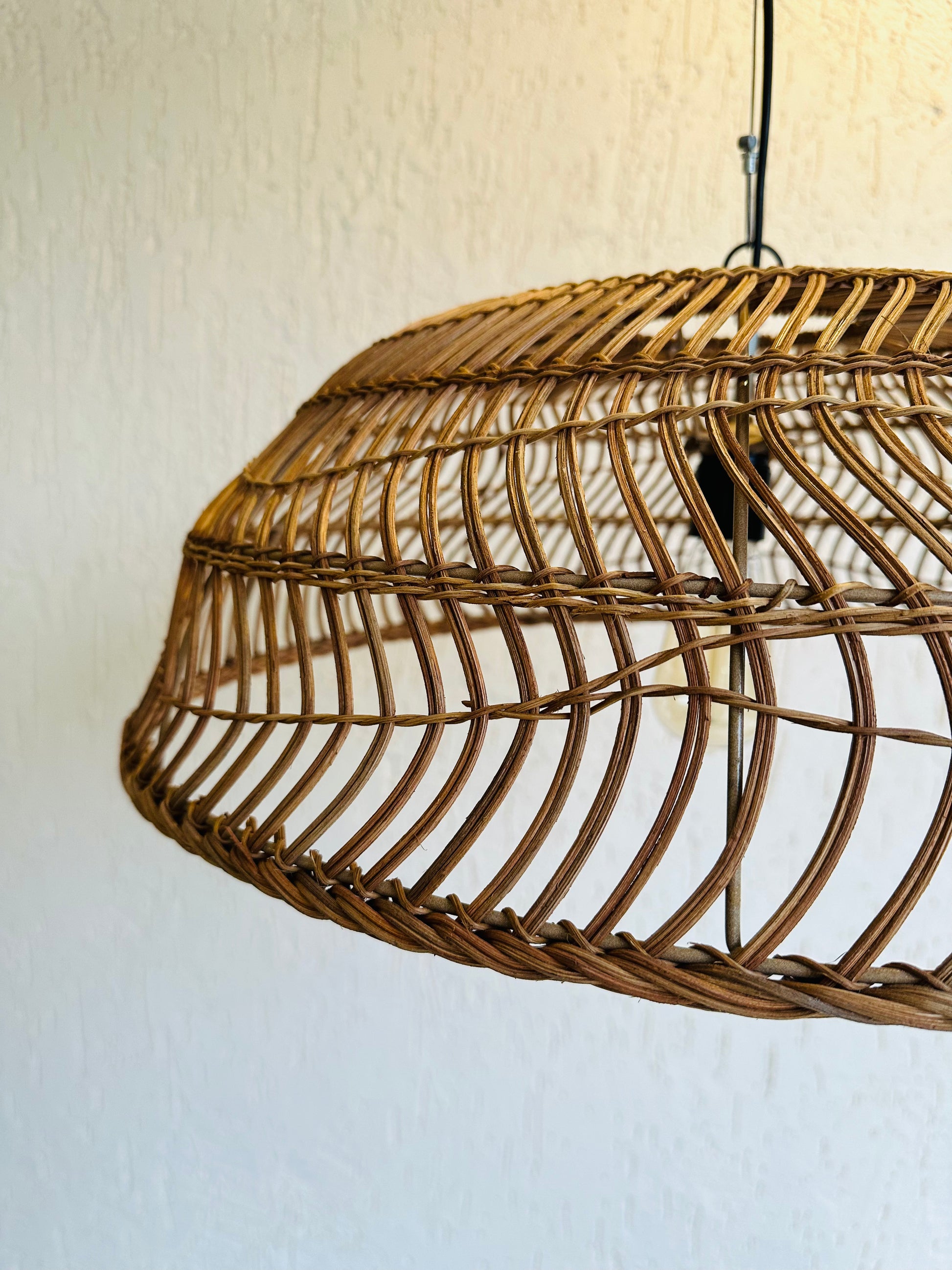 Handcrafted rattan pendant light adds bohemian charm to any space. Versatile design suits bedrooms, living areas, or covered patios. Expertly crafted for quality, adaptable to various ceiling heights. Each piece intricately woven by artisans, perfect for coastal, boho, or rustic decor. tesu