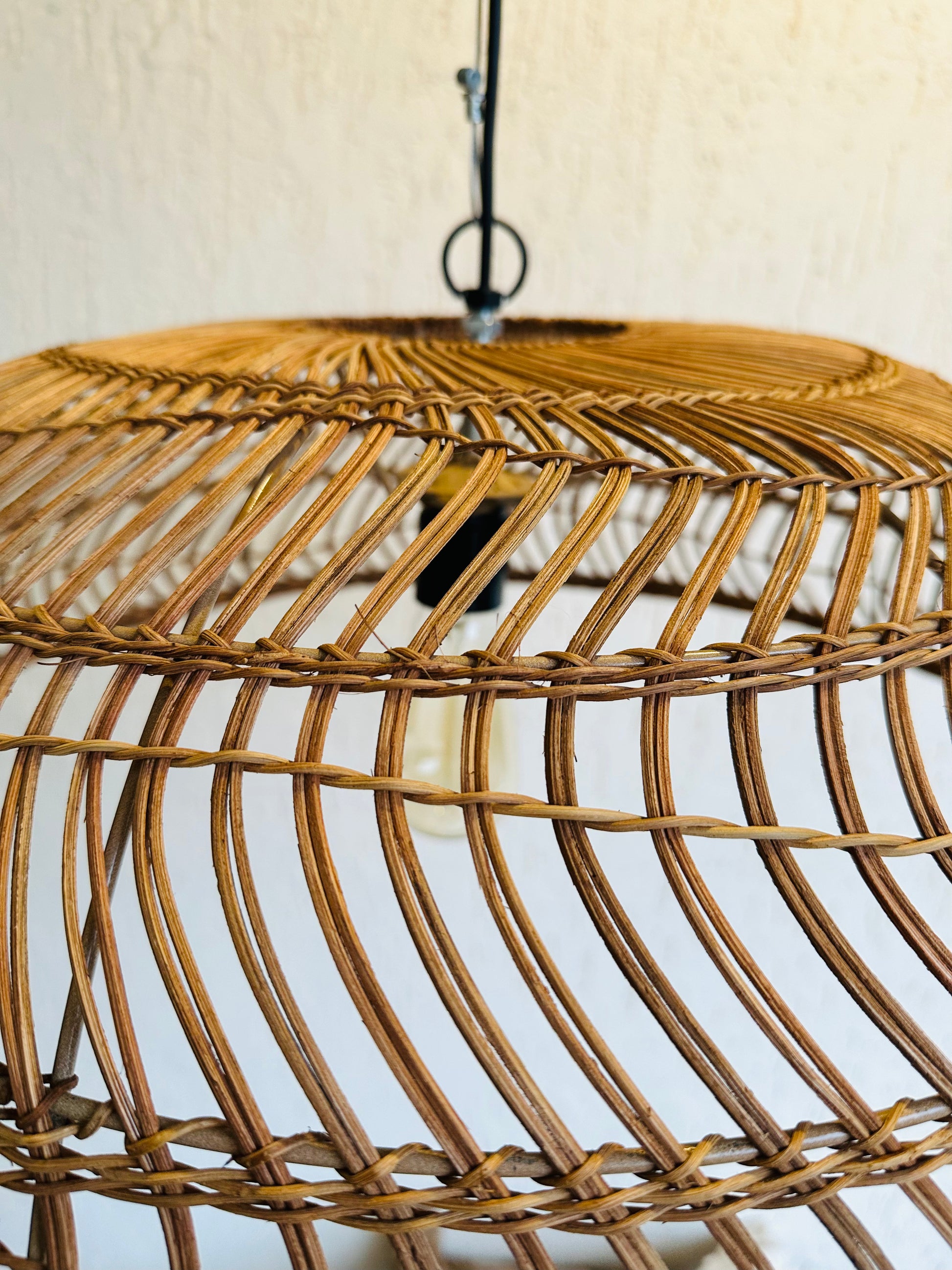 Handcrafted rattan pendant light adds bohemian charm to any space. Versatile design suits bedrooms, living areas, or covered patios. Expertly crafted for quality, adaptable to various ceiling heights. Each piece intricately woven by artisans, perfect for coastal, boho, or rustic decor. tesu