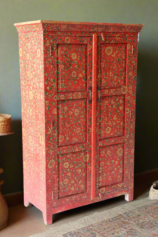 Adorned with intricate red floral hand-painting, this vibrant console adds a burst of color and artistry to any living space. 