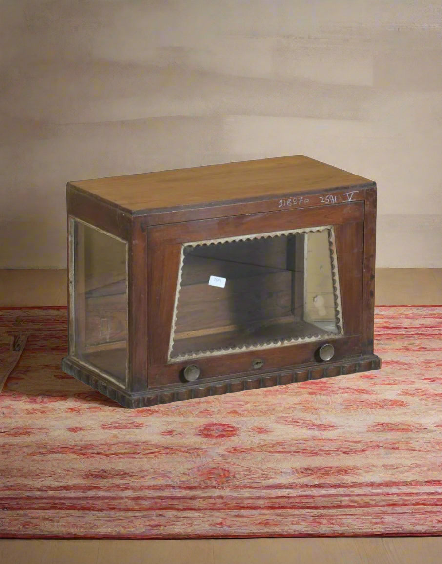 A vintage handcrafted teakwood display case featuring glass panels for a clear view of stored items.