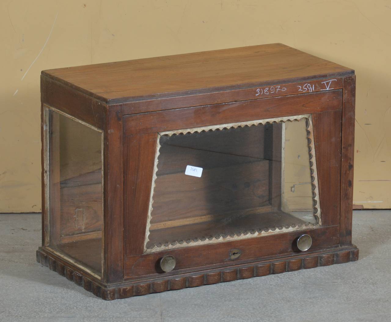 A vintage handcrafted teakwood display case featuring glass panels for a clear view of stored items.