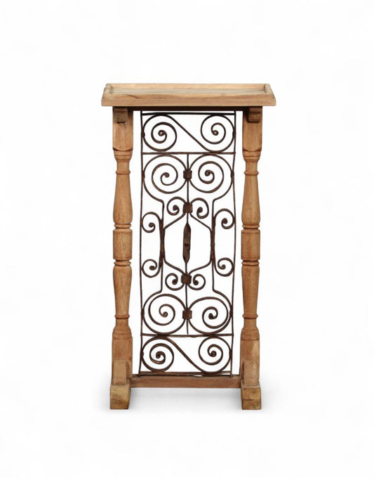 Wooden side table with decorative metal grille on a white background