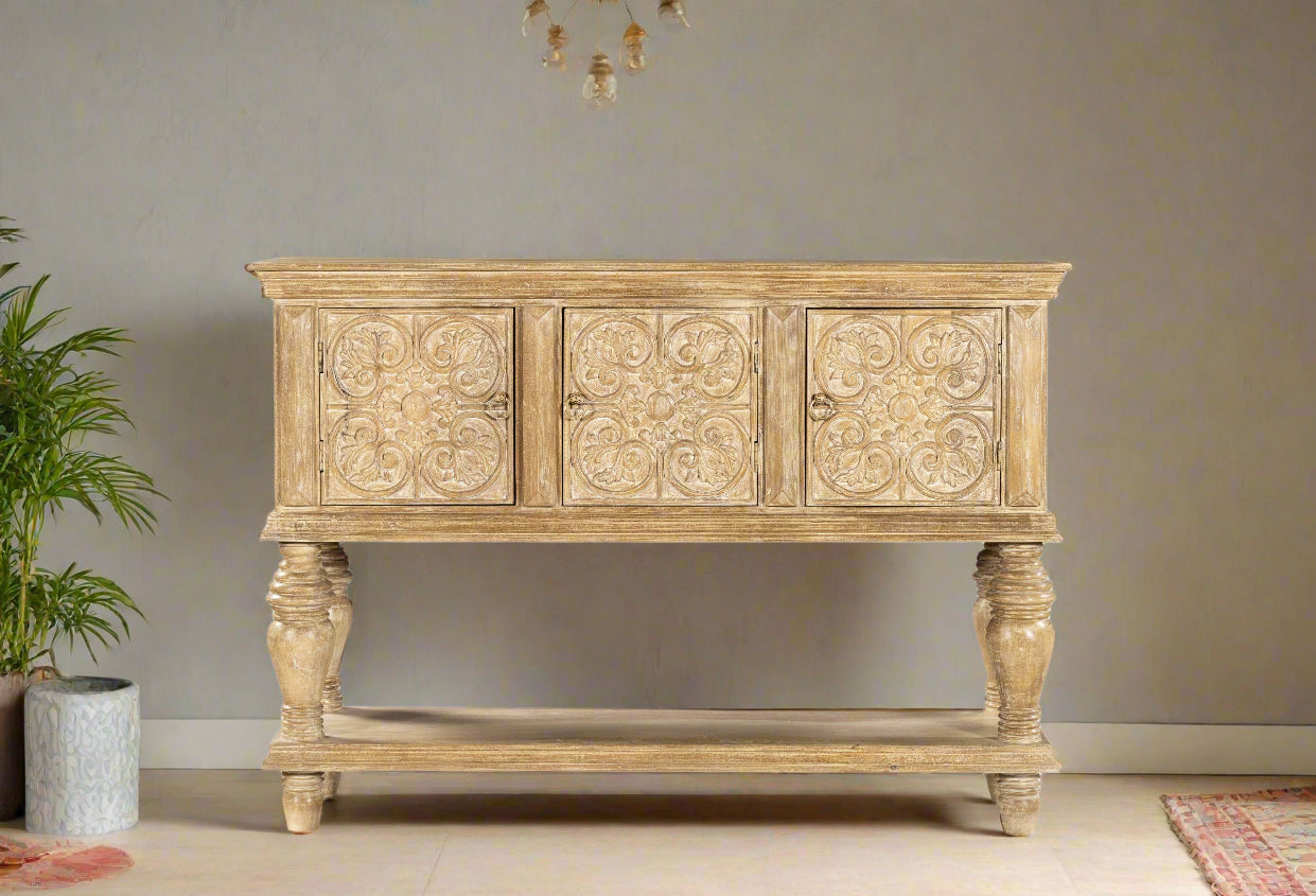 Bring timeless charm and artisanal elegance into your home with the Sandal Bloom Carved Console. 