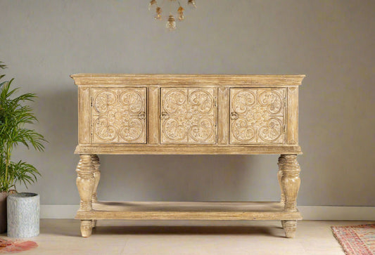 Bring timeless charm and artisanal elegance into your home with the Sandal Bloom Carved Console. 