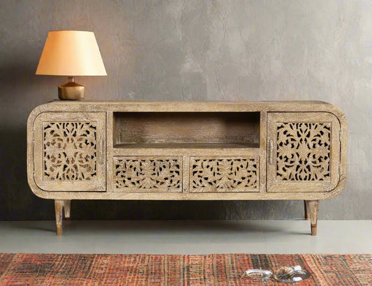 Bring timeless artistry and natural charm into your living space with the Sandal Bloom Media Console. 