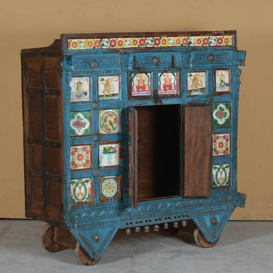 Handcrafted from durable teak wood, this traditional dowry chest is adorned with vibrant hand-painted panels featuring floral motifs